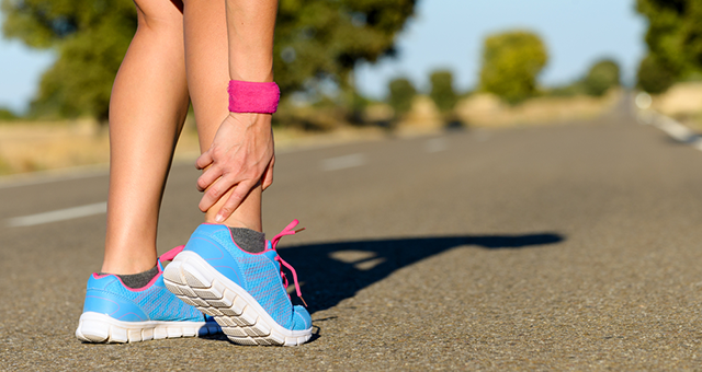 woman hurts her leg while running