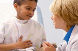 Doctor Checks Child with a Stomach Ache