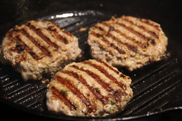 Turkey burgers cooking