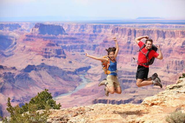 People jumping at the Grand Canyon