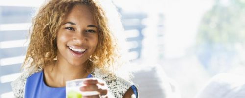 woman holding a cup of water