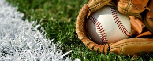 Baseball in a baseball mitt on a field