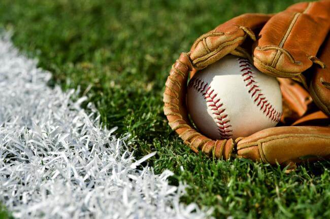 Baseball in a baseball mitt on a field