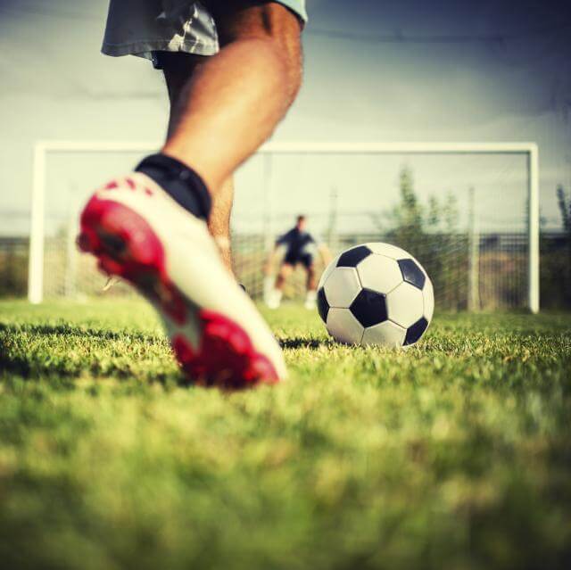 kicking a soccer ball