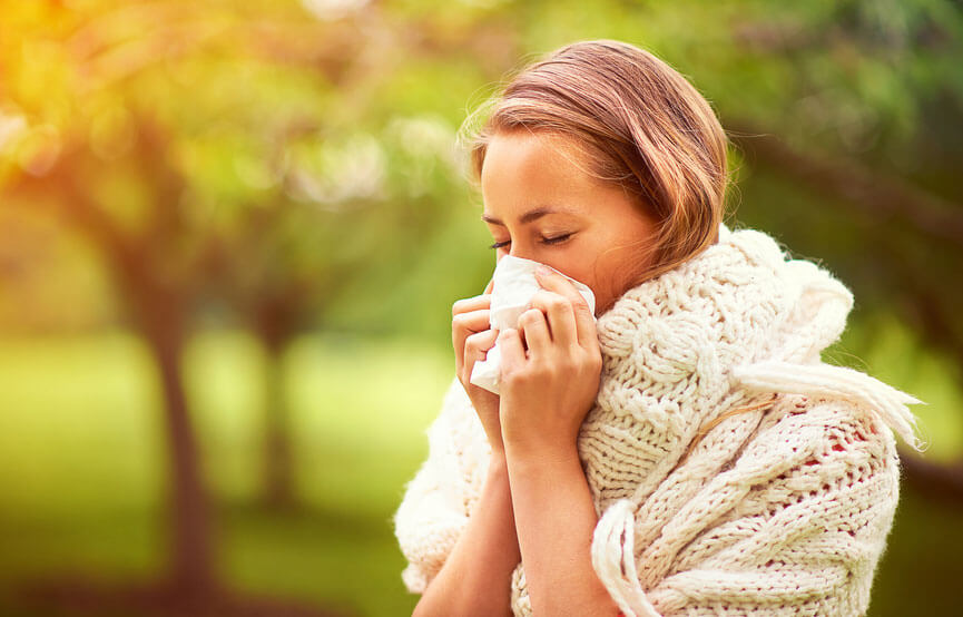 woman blowing her nose