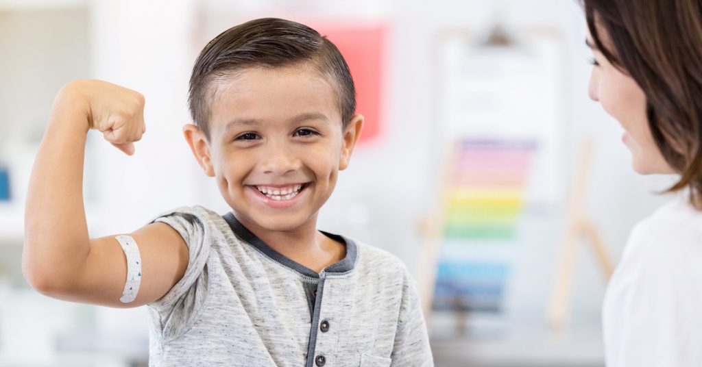 Picture of a boy getting a shot.