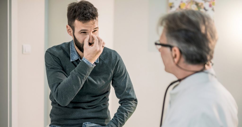 Picture of a patient talking to a doctor.