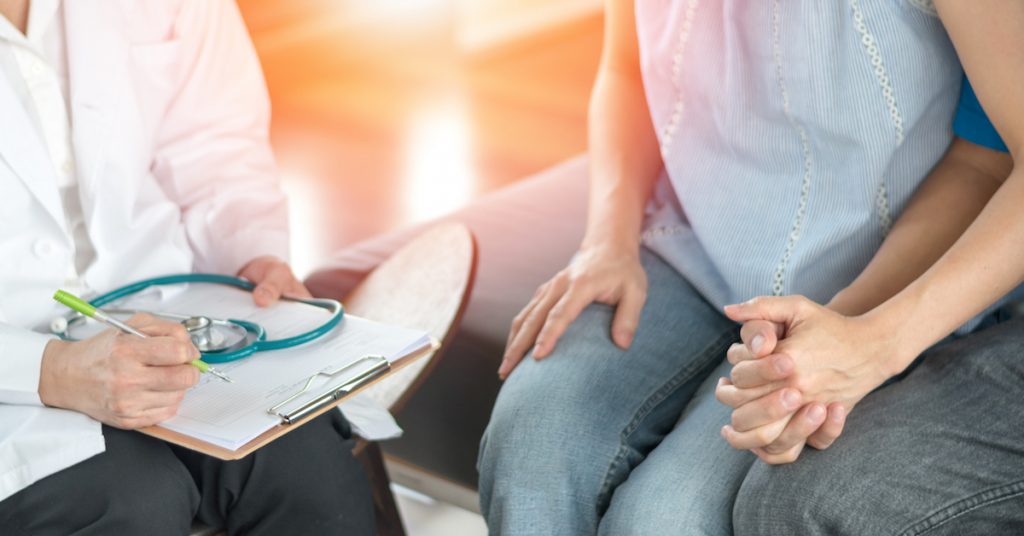 Image of couple talking to doctor.