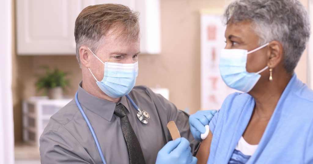 Picture of the provider giving the COVID-19 vaccine