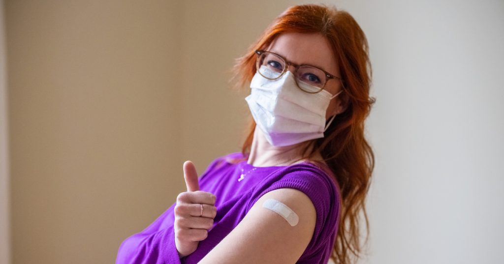 Happy woman after getting the COVID-19 vaccine