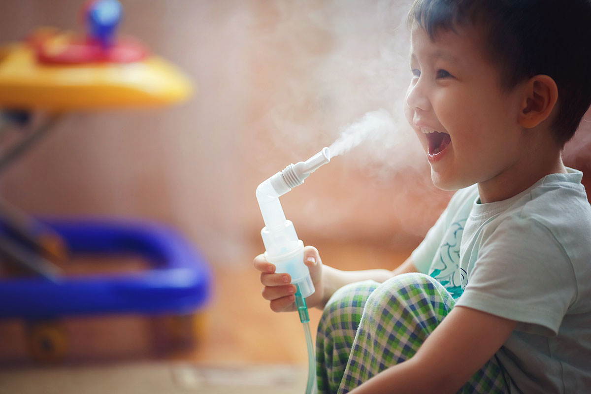 boy with nebulizer